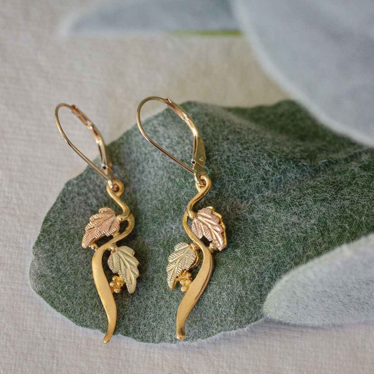 Black Hills Gold Grapevine Double Leaf Curved Dangle Earrings in 10K Yellow Gold front view