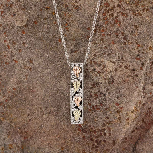 Black Hills Gold Leaf Vertical Bar Pendant in Sterling Silver front view