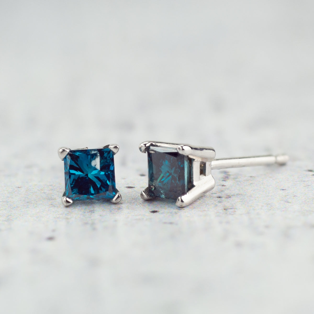 1/2 ct. tw. Princess Cut Treated Blue Diamond Solitaire Earrings in 14K White Gold front view