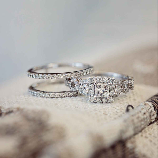 Noventa 1-1/2 ct. tw. Princess Cut Diamond Halo Wedding Set with Twist Band in 14K White Gold side profile