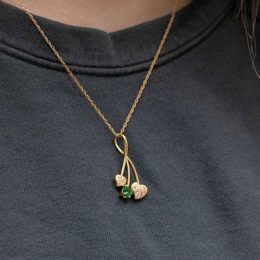 Black Hills Gold Heart Green Helenite & Double Pink Leaf Pendant in 10K Yellow Gold close-up detail