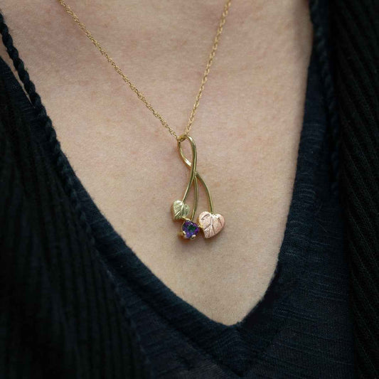 Black Hills Gold Heart Mystic Fire Topaz & Double Leaf Pendant in 10K Yellow Gold close-up detail