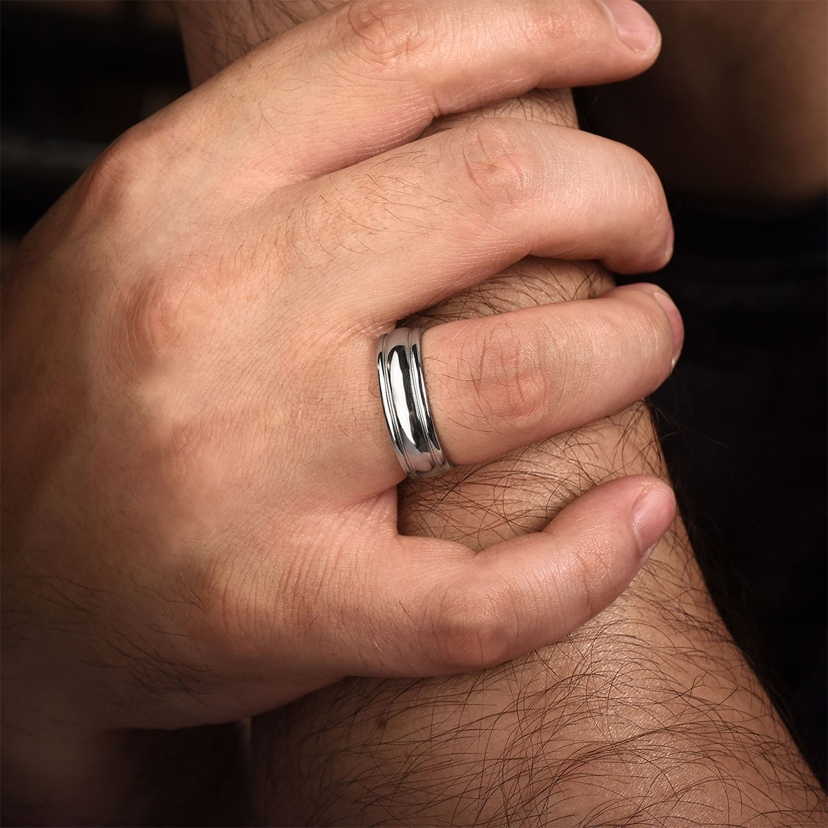 Gabriel & Co. William Men's 7mm Polished Finish Raised Center Wedding Ring in 14K White Gold close-up detail