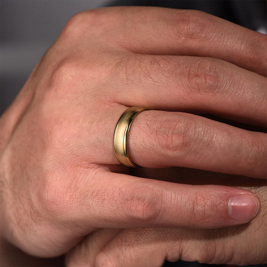 Gabriel & Co. Elijah Men's 6mm Sandblast Finish Polished Edge Wedding Ring in 14K Yellow Gold close-up detail