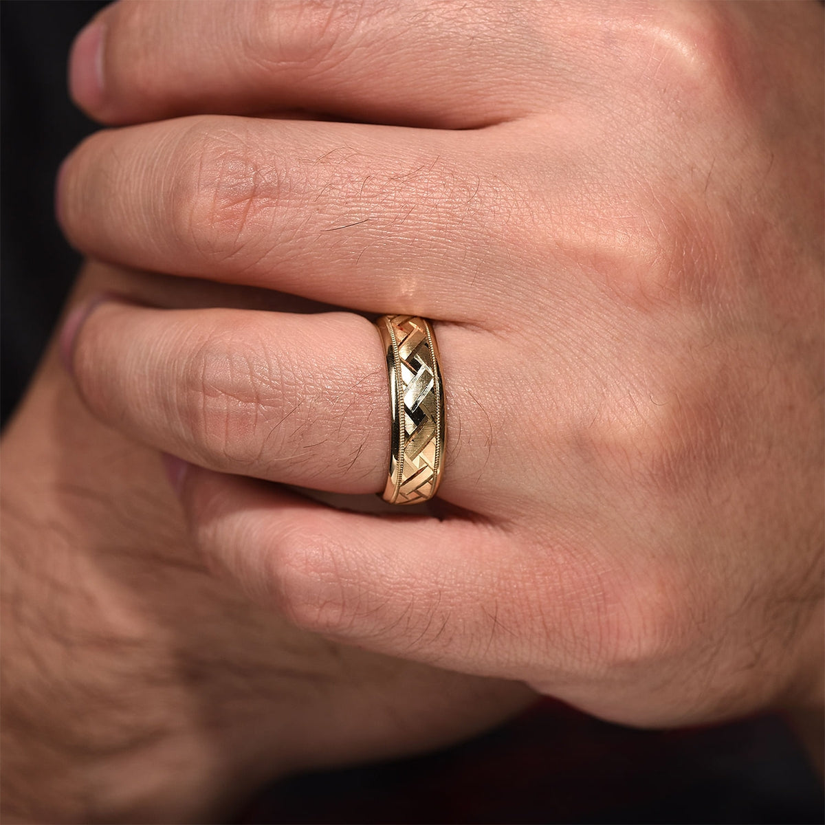 Gabriel & Co. Oliver Men's 7mm Satin Finish Engraved Woven Wedding Ring in 14K Yellow Gold close-up detail