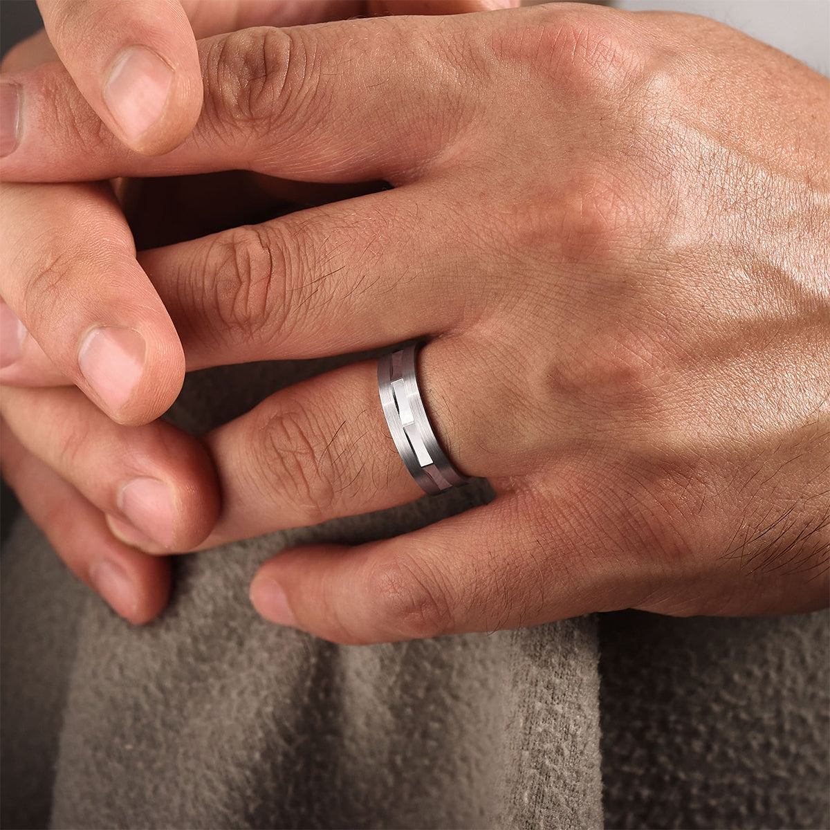Gabriel & Co. Elias Men's 6mm Satin Finish Groove & Brushed Edge Wedding Ring in 14K White Gold close-up detail