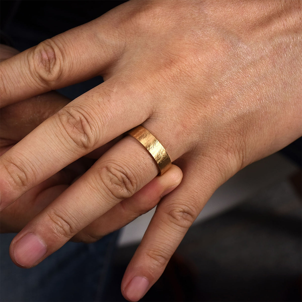 Gabriel & Co. Ian Men's 6mm Brushed Finish Flat Wedding Ring in 14K Yellow Gold close-up detail