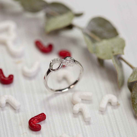 Journey collection 1/10 ct. tw. Diamond Infinity Fashion Ring in 10K White Gold close-up detail
