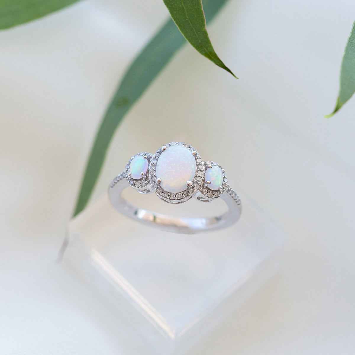 3-Stone Created Oval Opal & 1/5 ct. tw. Diamond Halo Ring in 10K White Gold side profile