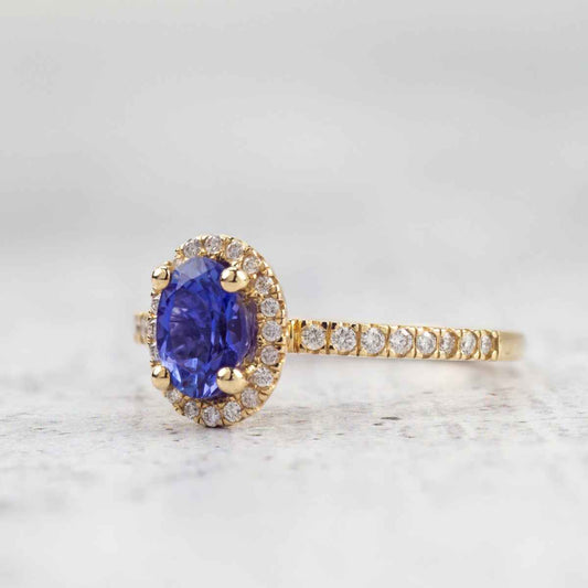 Oval Tanzanite & 1/5 ct. tw. Diamond Halo Ring in 14K Yellow Gold close-up detail