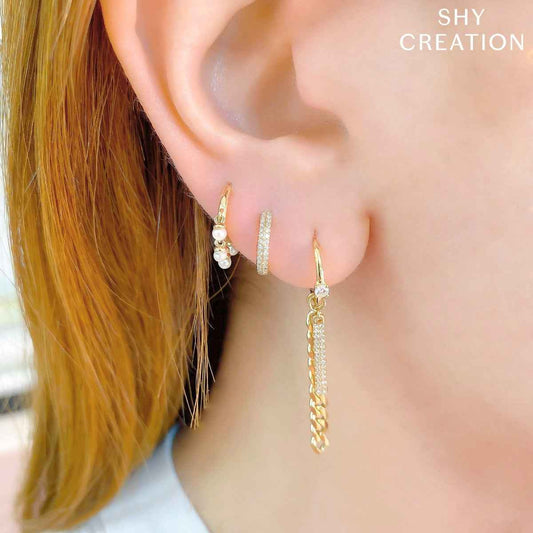 Shy Creation 1/8 ct. tw. Diamond Pave Huggie Hoop Earrings in 14K Yellow Gold front view