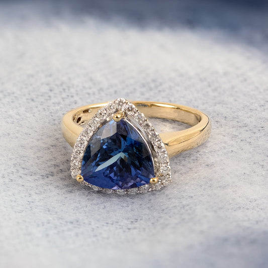 Trillion Tanzanite & 1/3 ct. tw. Diamond Halo Ring in 14K Yellow Gold close-up detail