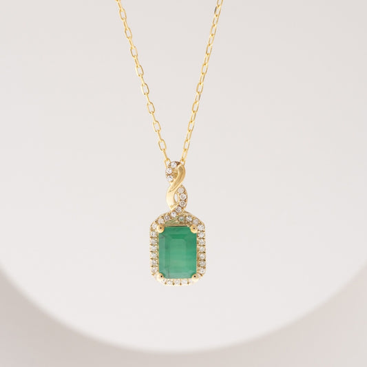 Infinite Love Emerald Cut Emerald & 1/10 ct. tw. Diamond Pendant in 10K Yellow Gold front view
