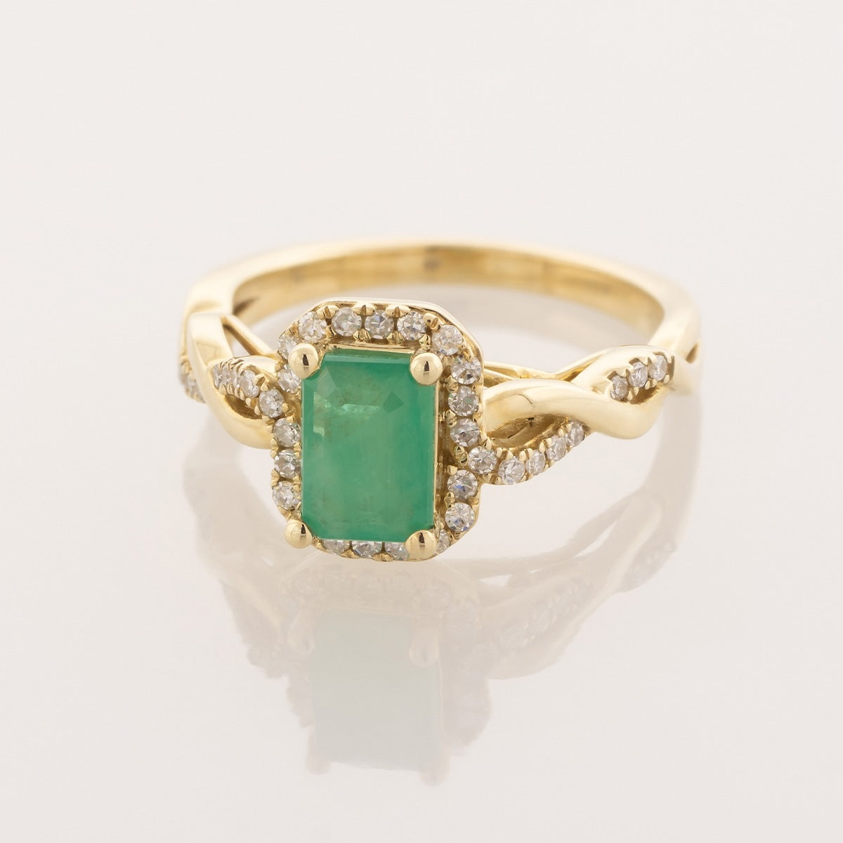 Infinite Love Emerald Cut Emerald & 1/5 ct. tw. Diamond Halo Ring in 10K Yellow Gold front view