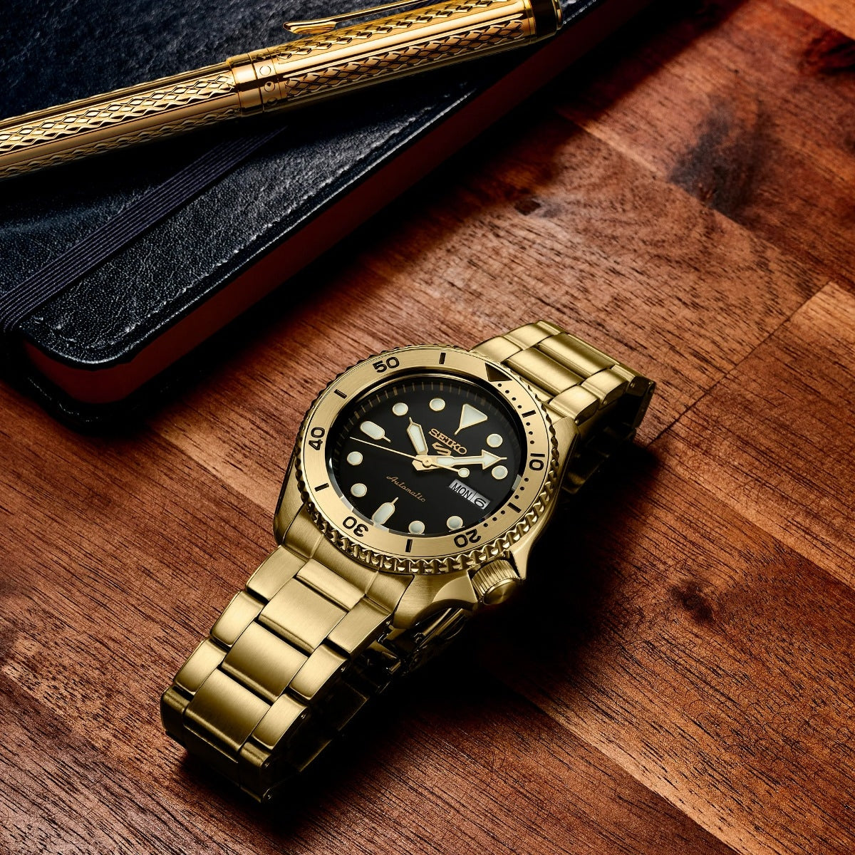 Seiko Men's 5 Sports U.S. Special Creation Automatic Gold-Tone Stainless Steel Watch with Black Dial front view
