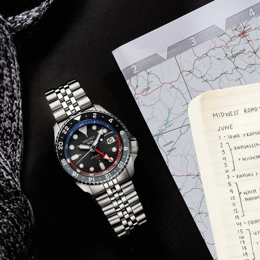 Seiko Men's 5 Sports SKX Series Automatic Stainless Steel Watch with Dark Gray, Blue & Red Accent Dial front view