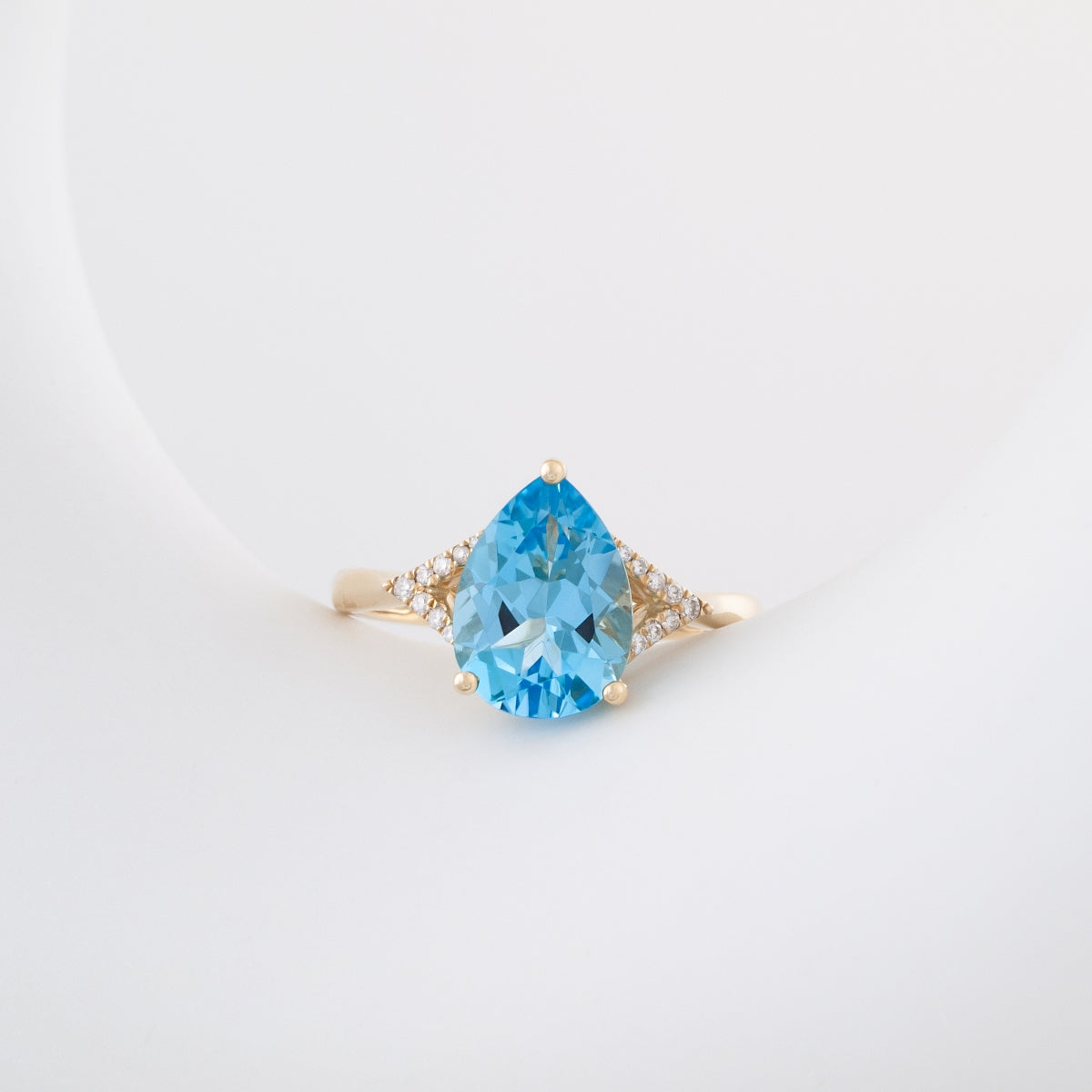Pear Swiss Blue Topaz & Diamond Accent Ring in 10K Yellow Gold close-up detail