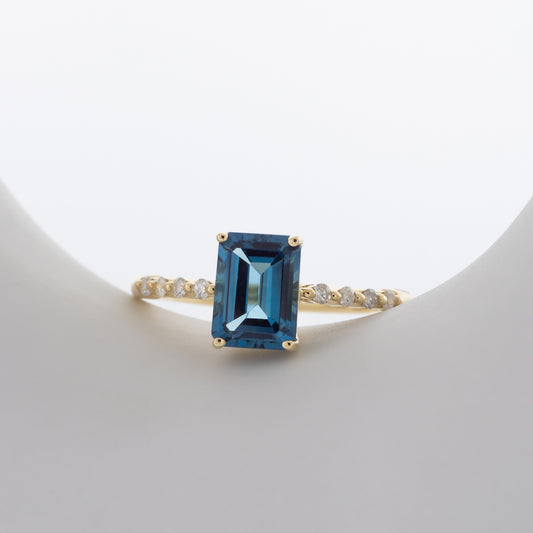 Emerald Cut London Blue Topaz & 1/8 ct. tw. Diamond Ring in 10K Yellow Gold close-up detail