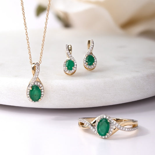 Infinite Love Oval Emerald & 1/8 ct. tw. Diamond Halo Twist Earrings in 10K Yellow Gold front view
