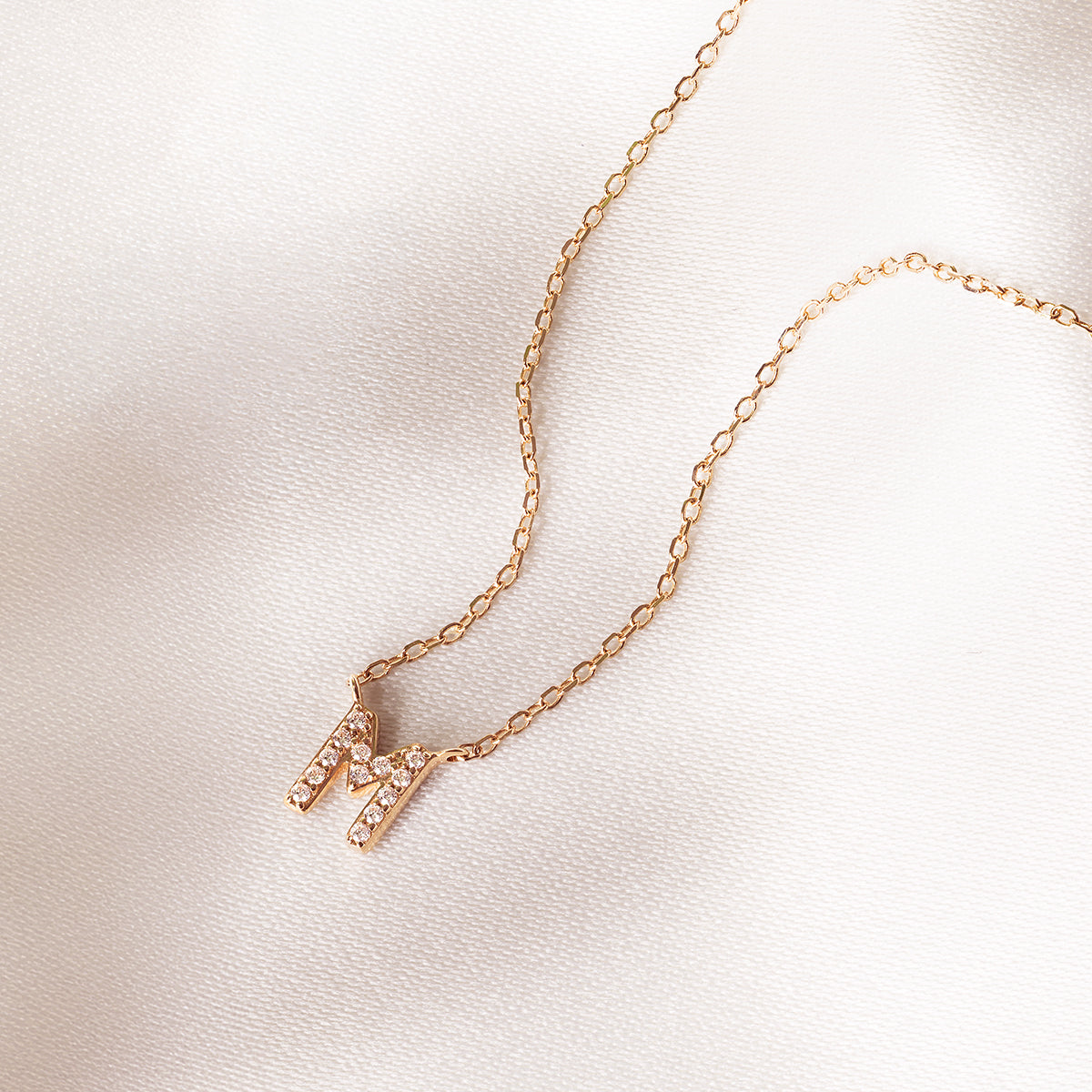 10k yellow gold initial m necklace with 1/20 ct. tw. diamond accents
