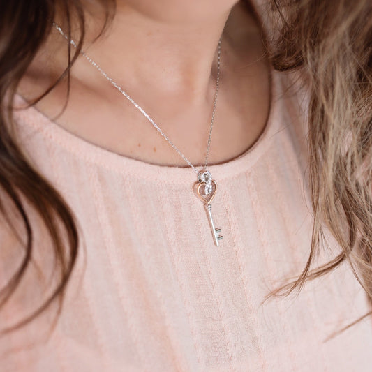 Infinite Love 1/6 ct. tw. Diamond Heart Key Pendant in Sterling Silver and 10K Pink Gold front view