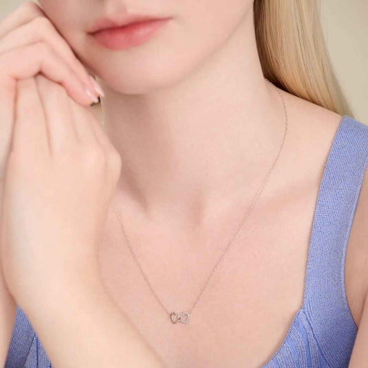M by Monte Luna 1/10 ct. tw. Lab-Grown Diamond Open Twin Heart Necklace in Rhodium Plated Sterling Silver front view