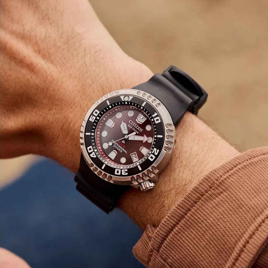 Citizen Men's Promaster Dive E365 Eco-Drive Stainless Steel Watch with Red Dial & Black Benebiol Strap close-up detail