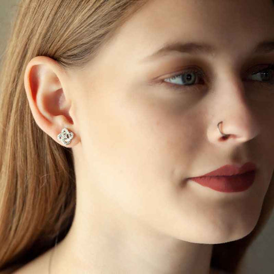Love Knot 1/3 ct. tw. Diamond Classic Knot Fashion Earrings in 10K White Gold close-up detail