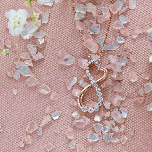 Journey 1/4 ct. tw. Round Diamond Infinity Heart Pendant in 10K Pink Gold close-up detail