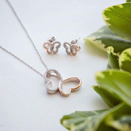 Infinite Love 1/6 ct. tw. Diamond Butterfly Pendant in Sterling Silver and 10K Pink Gold front view