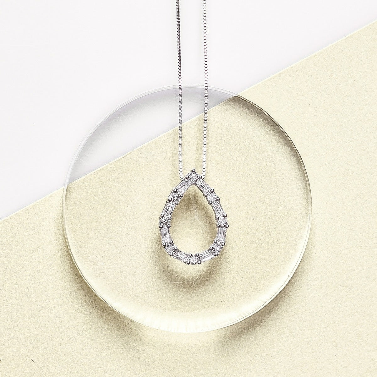 1/4 ct. tw. Round & Baguette Diamond Pear-Shaped Pendant in 10K White Gold close-up detail