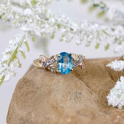 Black Hills Gold Oval Blue Topaz & Diamond Accent Ring in 10K Yellow Gold close-up detail