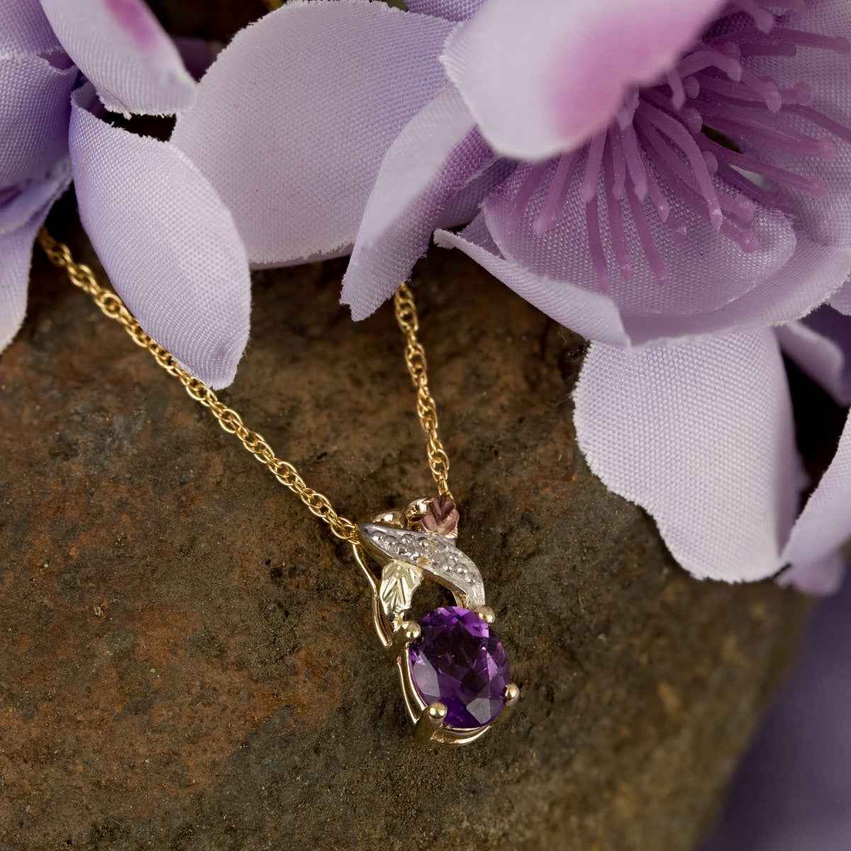 Black Hills Gold Oval Amethyst & Diamond Accent Twist Pendant in 10K Yellow Gold front view