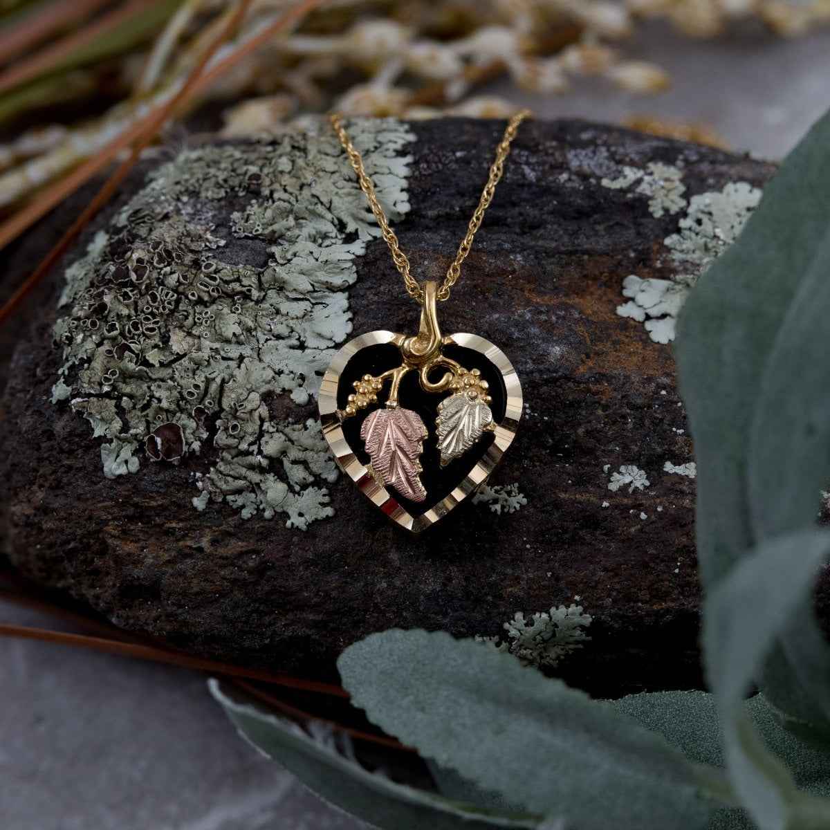 Black Hills Gold Onyx Heart Pendant with Grapevine & Leaf Accent in 10K Yellow Gold front view