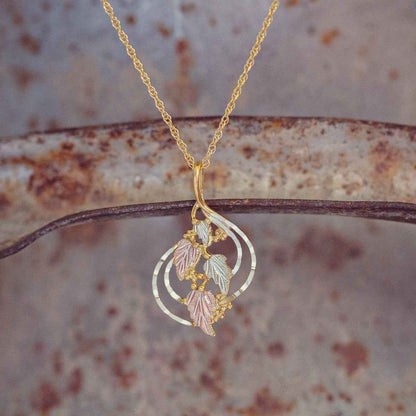 Black Hills Gold Ladies' Hanging Grape Vine & Leaf Pendant with Hammered Gold Detailing in 10K Yellow Gold front view