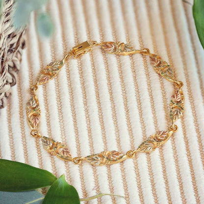 Black Hills Gold 8-inch Diamond Cut Grapevine & Leaf Link Bracelet in 10K Yellow Gold front view