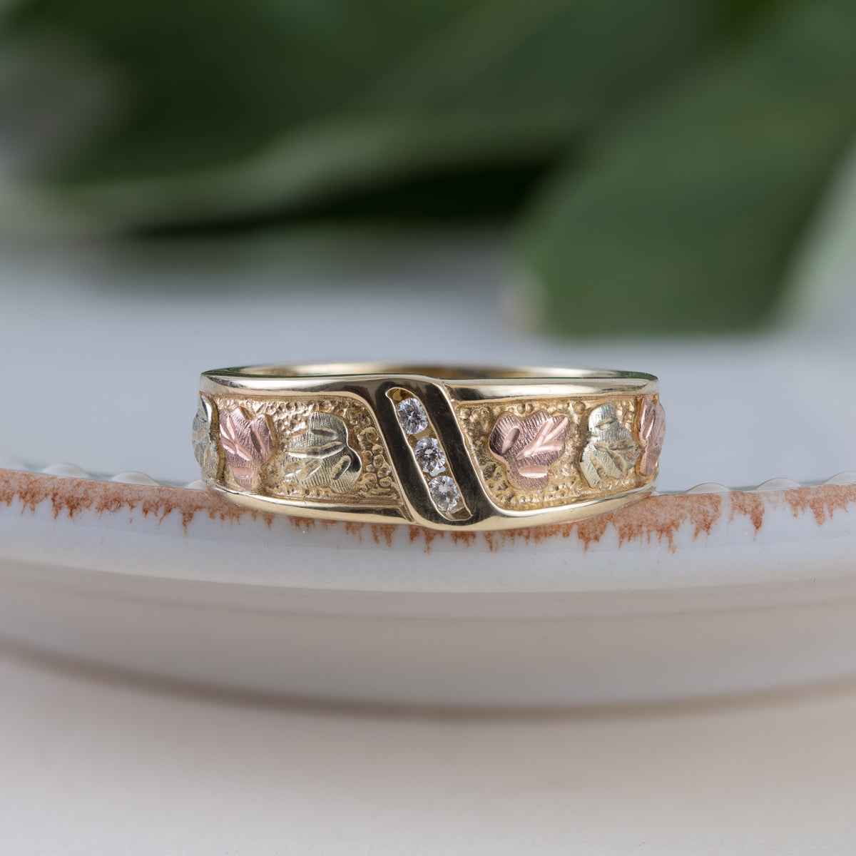 Black Hills Gold Men's 3-Stone Diamond Accent Channel Set Textured Wedding Ring in 10K Yellow Gold front view