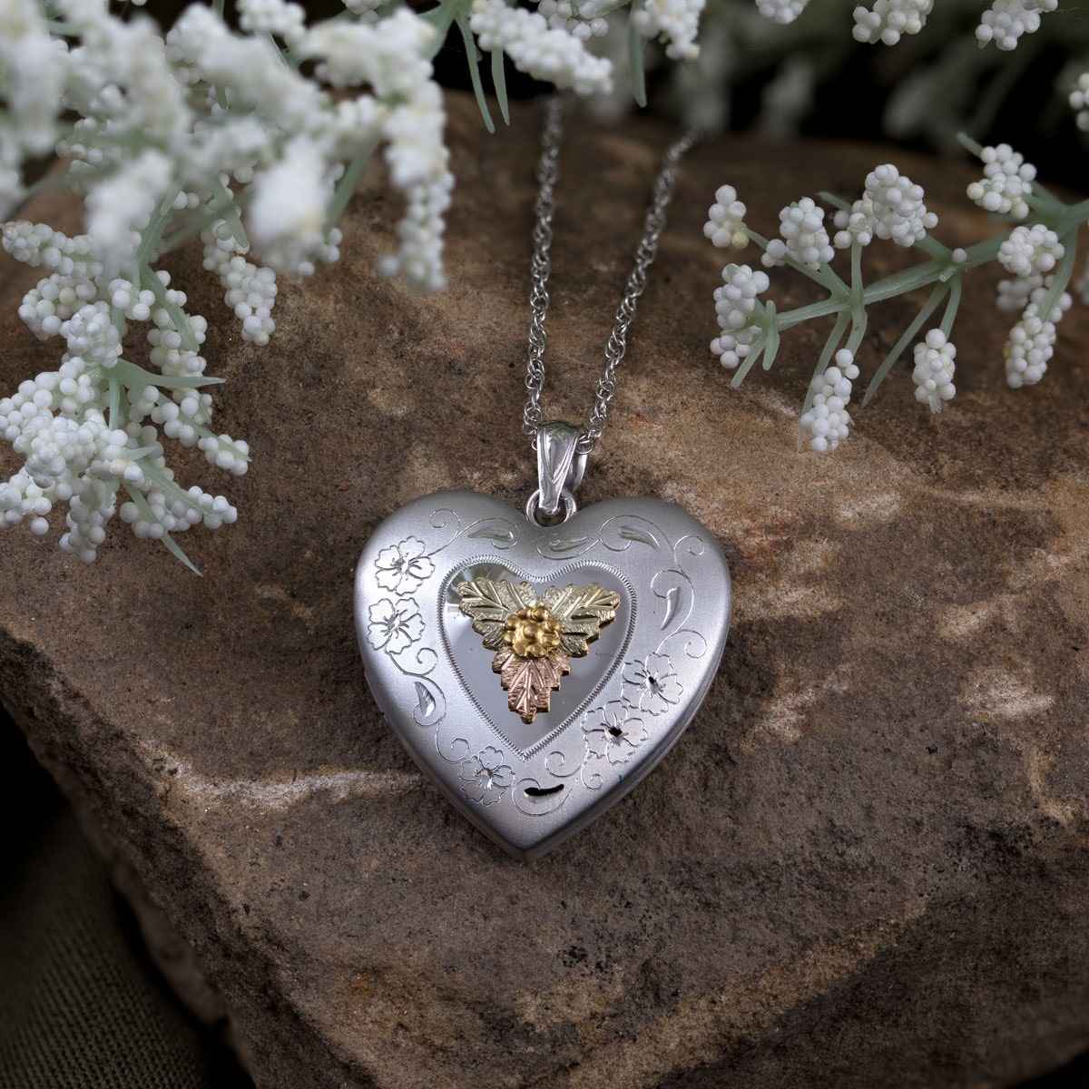 Black Hills Gold Large Heart Locket with Flower Etching in Stainless Steel close-up detail