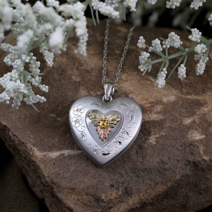 Black Hills Gold Large Heart Locket with Flower Etching in Stainless Steel close-up detail