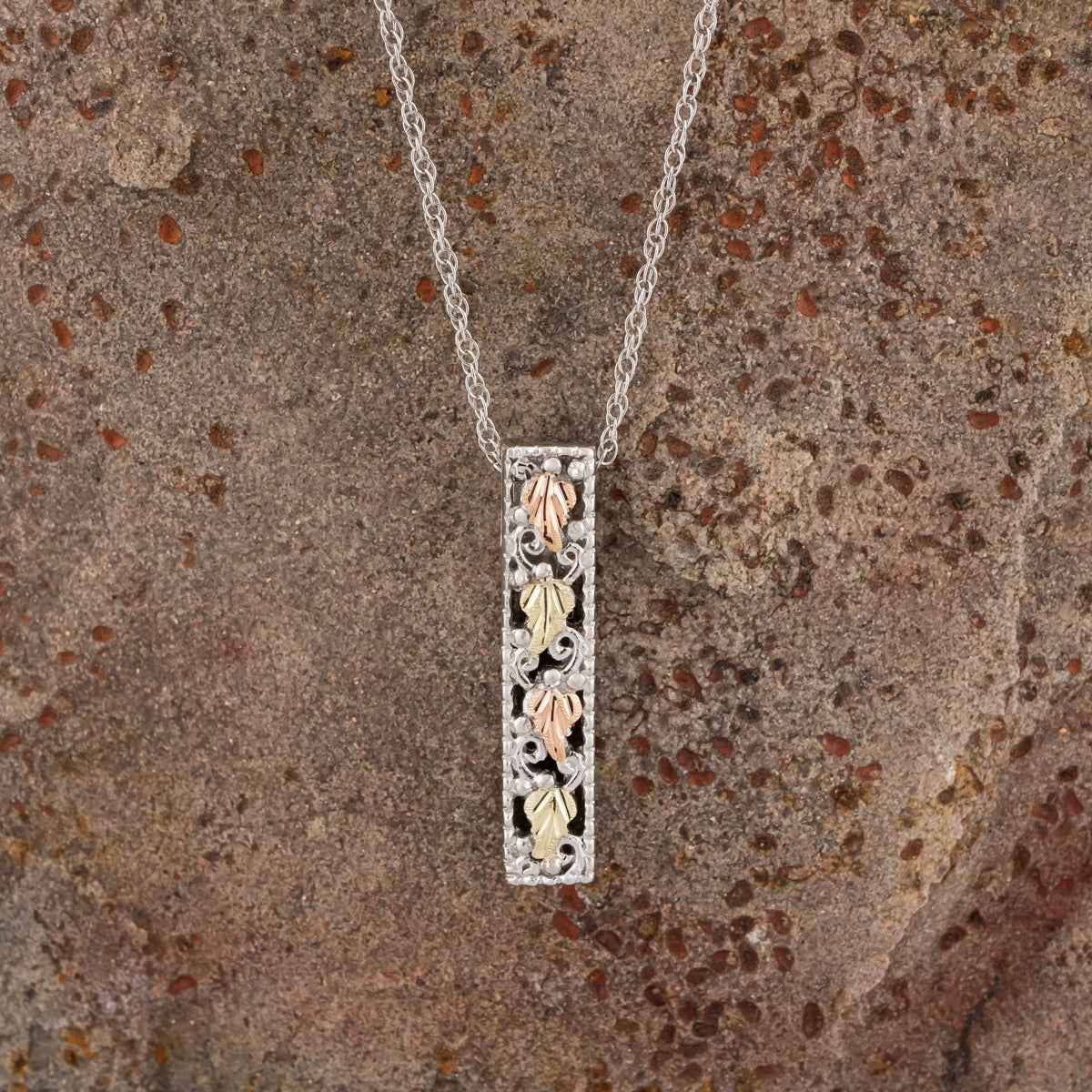 Black Hills Gold Leaf Vertical Bar Pendant in Sterling Silver front view