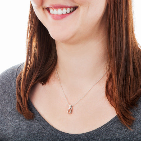 Black Hills Gold Saddle Stirrup Pendant in Sterling Silver front view