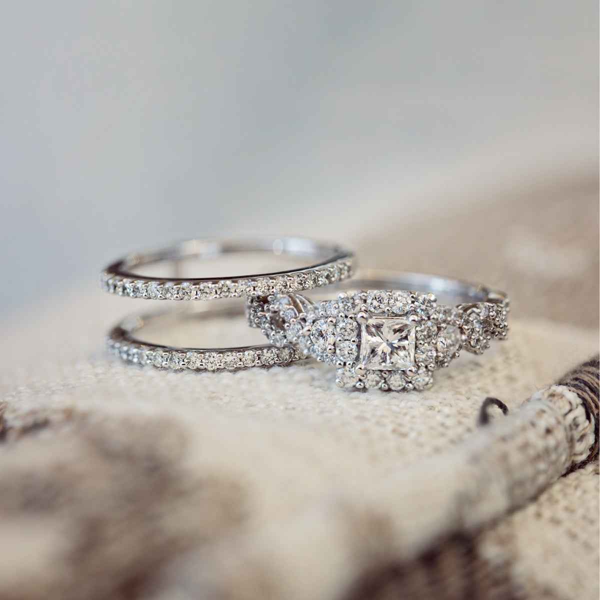 Noventa 1-1/2 ct. tw. Princess Cut Diamond Halo Wedding Set with Twist Band in 14K White Gold side profile
