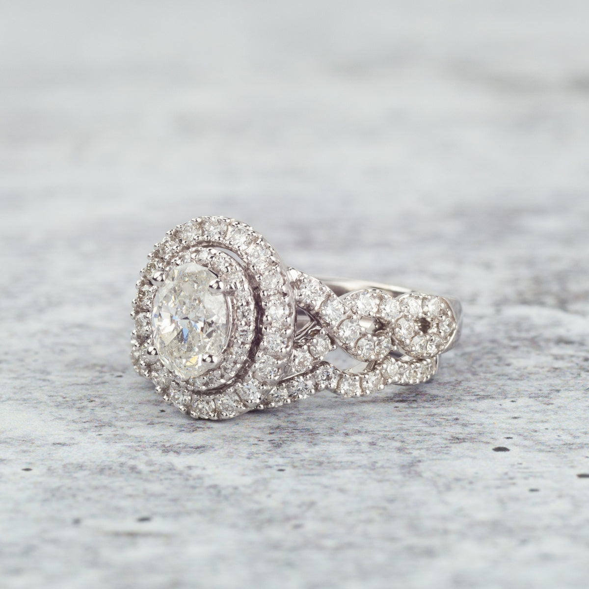 Amaura Collection 2-1/4 ct. tw. Oval Diamond Halo Wedding Set with Twist Band in 14K White Gold full view