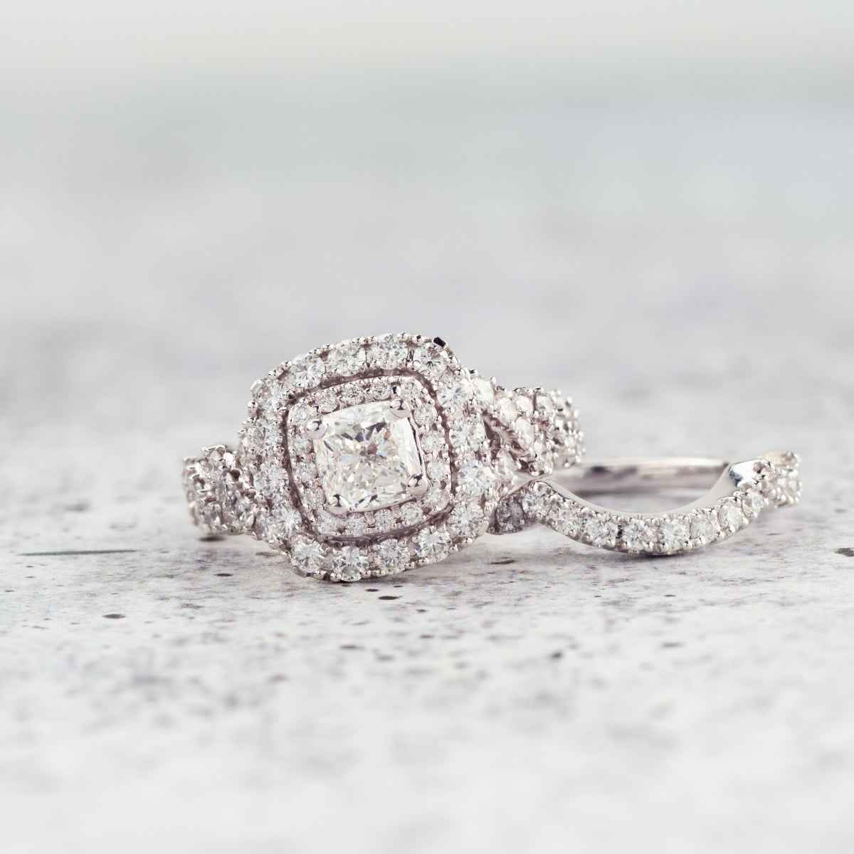 Natural 2-1/2 ct. tw. Cushion Diamond Double Halo Twist Wedding Set in 14K White Gold side profile