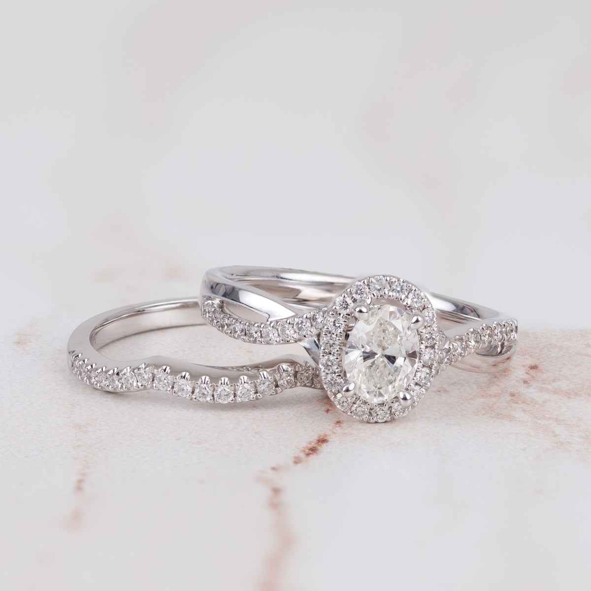 Canadian Rocks 5/6 ct. tw. Oval Diamond Halo Wedding Set with Twisted Designed Band in 14K White Gold side profile