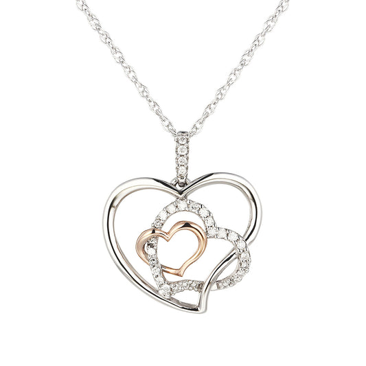 A silver-toned heart-shaped pendant necklace with a smaller pink gold heart in the center, surrounded by another heart of white diamonds.
