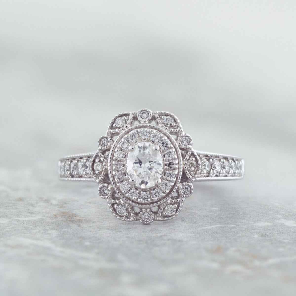 Elegance 5/8 ct. tw. Oval Diamond Double Halo Milgrain Engagement Ring in 14K White Gold front view