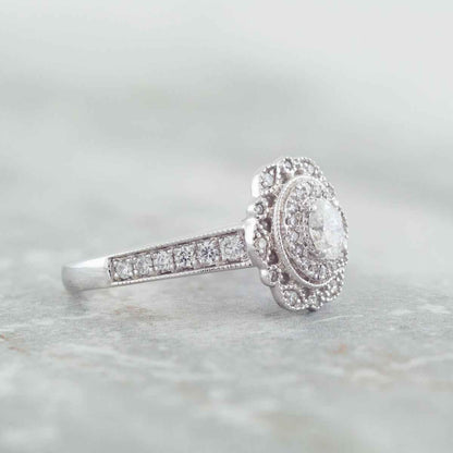 Elegance 5/8 ct. tw. Oval Diamond Double Halo Milgrain Engagement Ring in 14K White Gold close-up detail