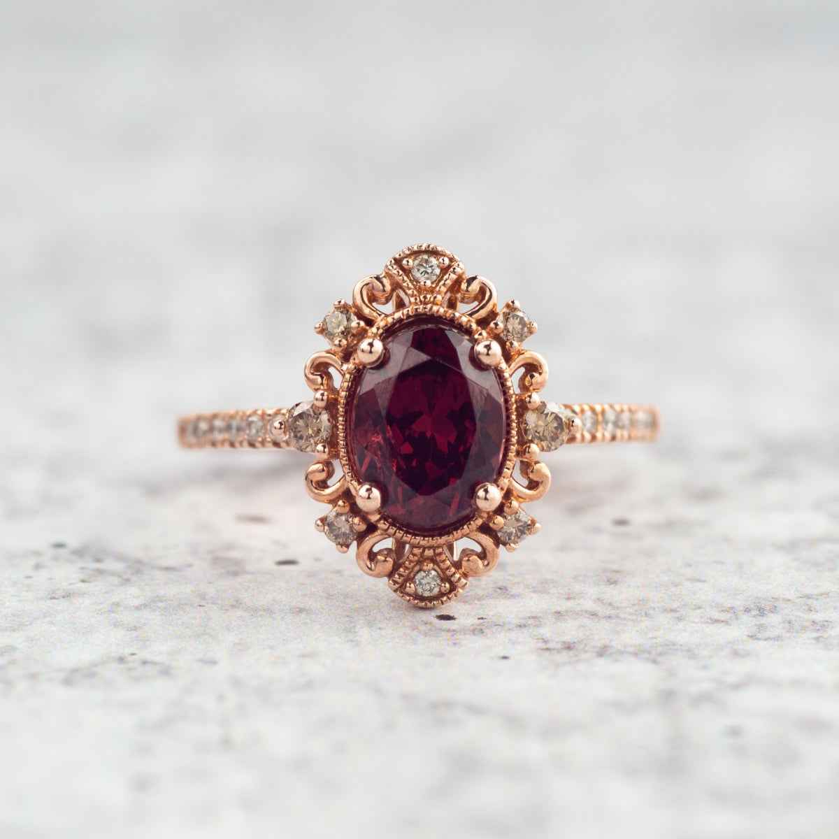 Impulse Collection Genuine Oval Garnet Engagement Ring with 1/4 ct. tw. Mocha & White Diamond Filigree close-up detail
