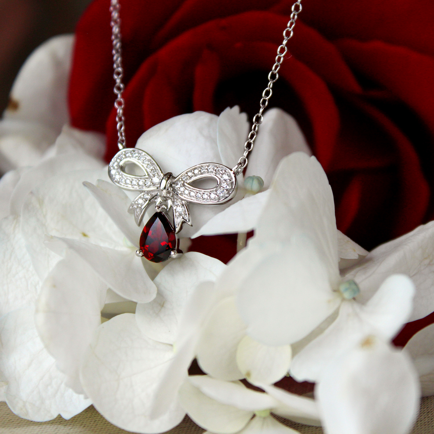 Enchanted Disney Snow White 1/7 ct. tw. Diamond and Teardrop Garnet Necklace in Sterling Silver front view